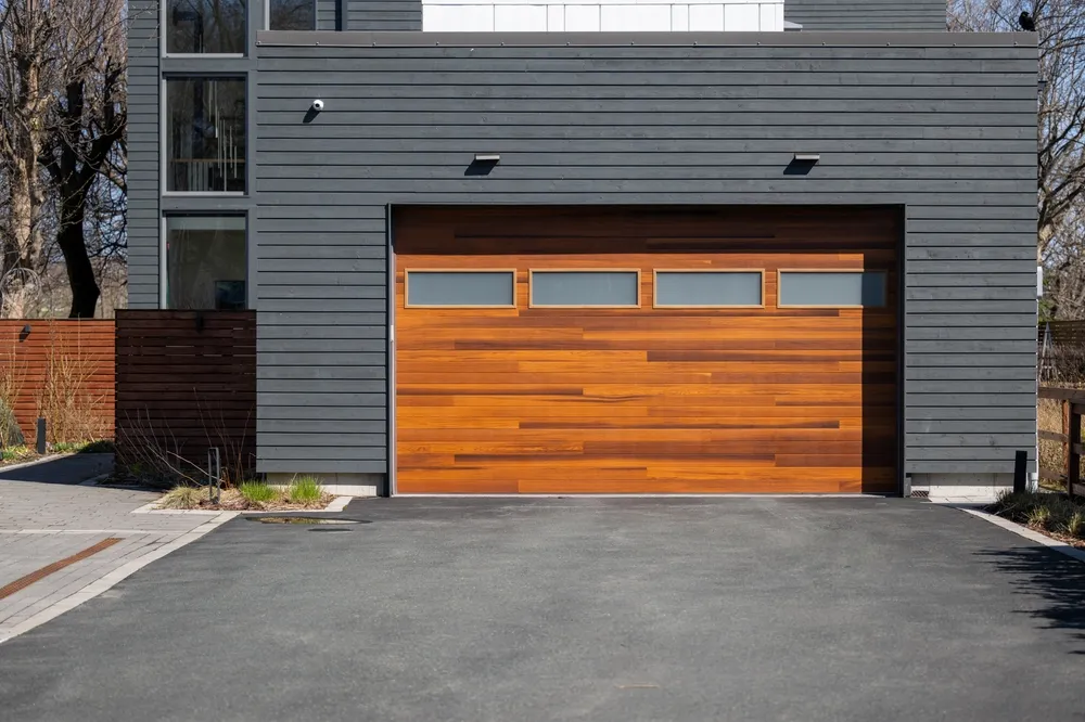 Modern wood plank garage door on residential home