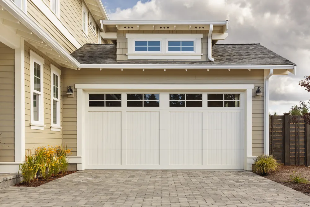 White carriage style garage door on residential home